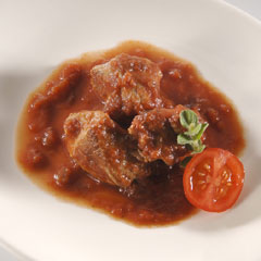 Beef cooked in red sauce in Pan