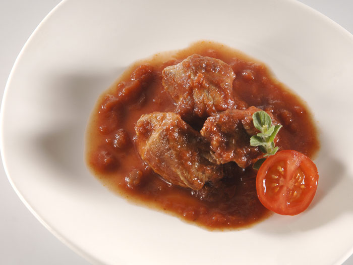Beef cooked in red sauce in Pan